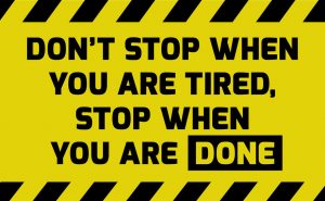 Don't stop when you are tired sign yellow with stripes, road sign variation. Bright vivid sign with warning message.